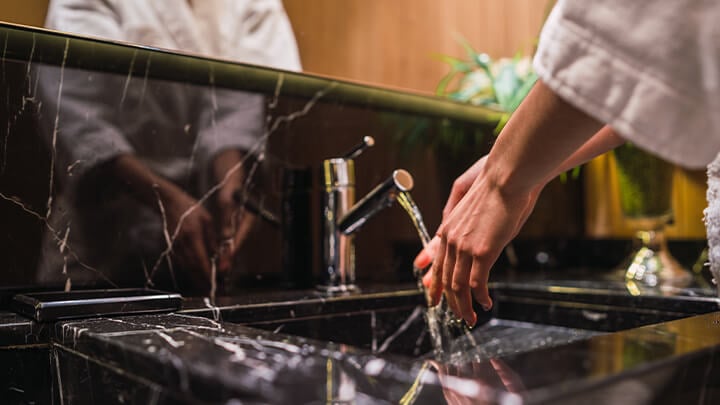 Washing hands in sink